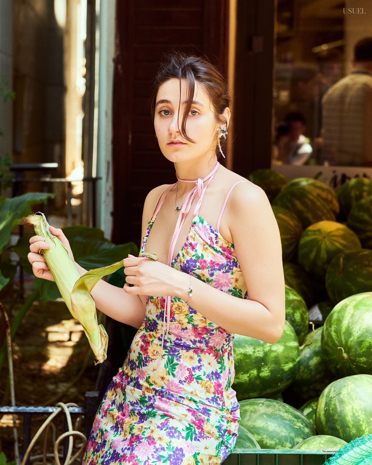 Model Sena Yapar in a floral dress at Büyükada market