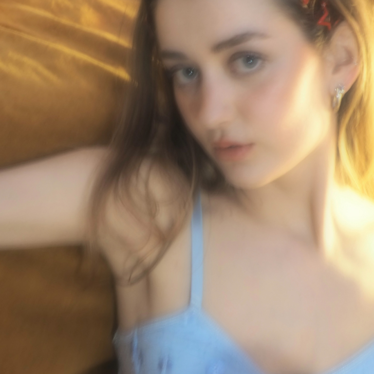 Woman in light blue lingerie lying on a wooden floor